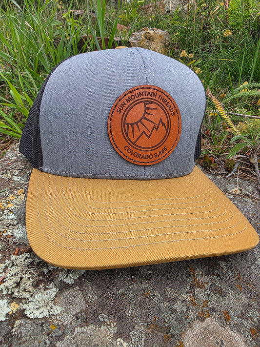 Mountleisure - Sun Mountain Threads Leather Patch Trucker Hat CoO 8,465 Amber/ Grey/ Black